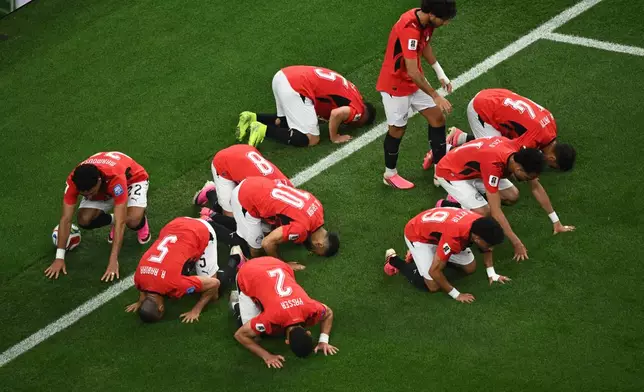 Egypt players bow in prayer after scoring opening goal during the World Cup round of 32 soccer match between Australia and Egypt in Arlington, Texas, near Dallas, Friday, July 3, 2026. (AP Photo/Jessica Tobias)