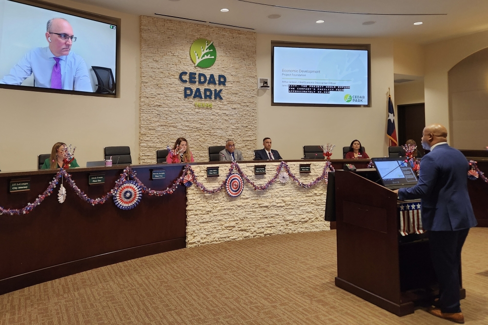 Chief Economic Development Officer Arthur Jackson discusses a deal between the city and construction supply company Texas Materials at the June 25 Cedar Park City Council meeting. (Daniel Schwalm/Community Impact)