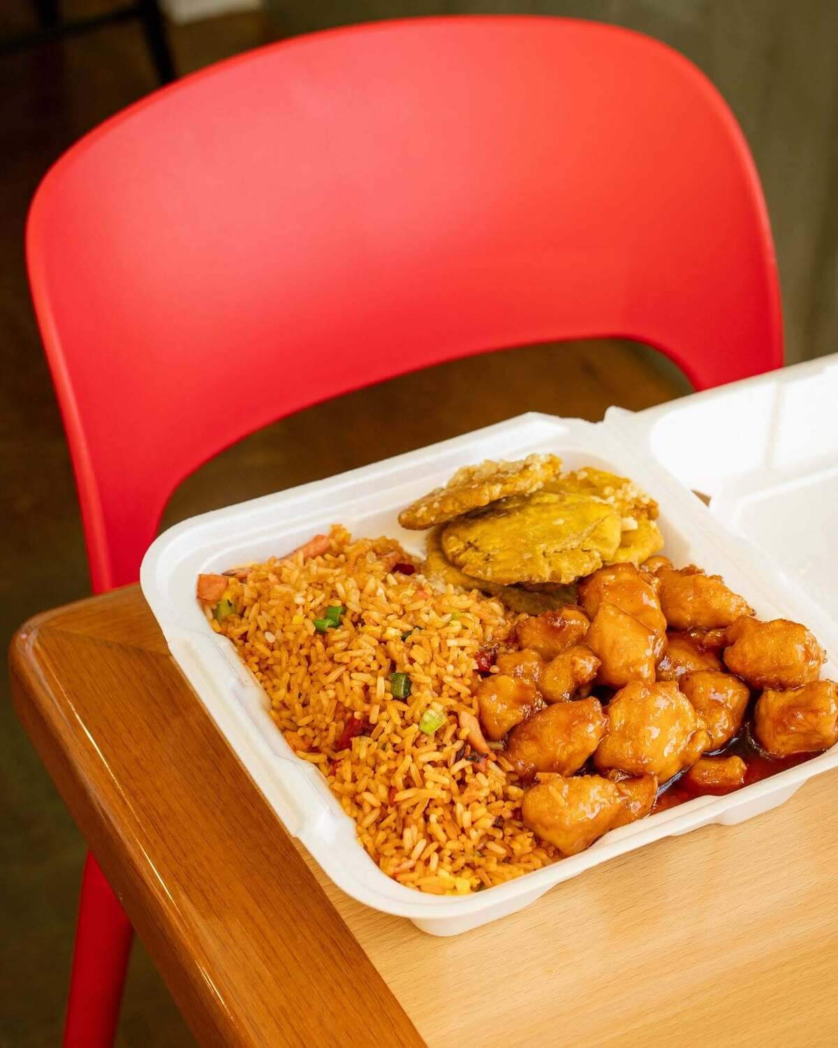 Michy’s Chino Boricua in Grand Prairie blends Chinese and Puerto Rican cuisines. Pictured here is the orange chicken with a side of garlic butter fired plantains.