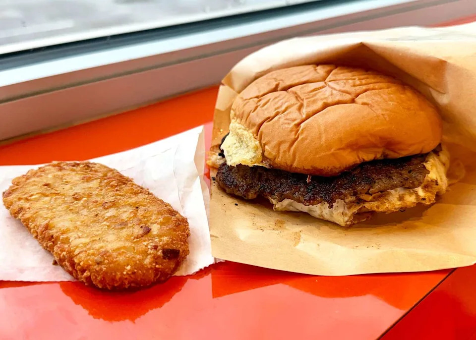 Breakfast sandwich and hasbrown at Stuffed Belly. (Bao Ong / Houston Chronicle)