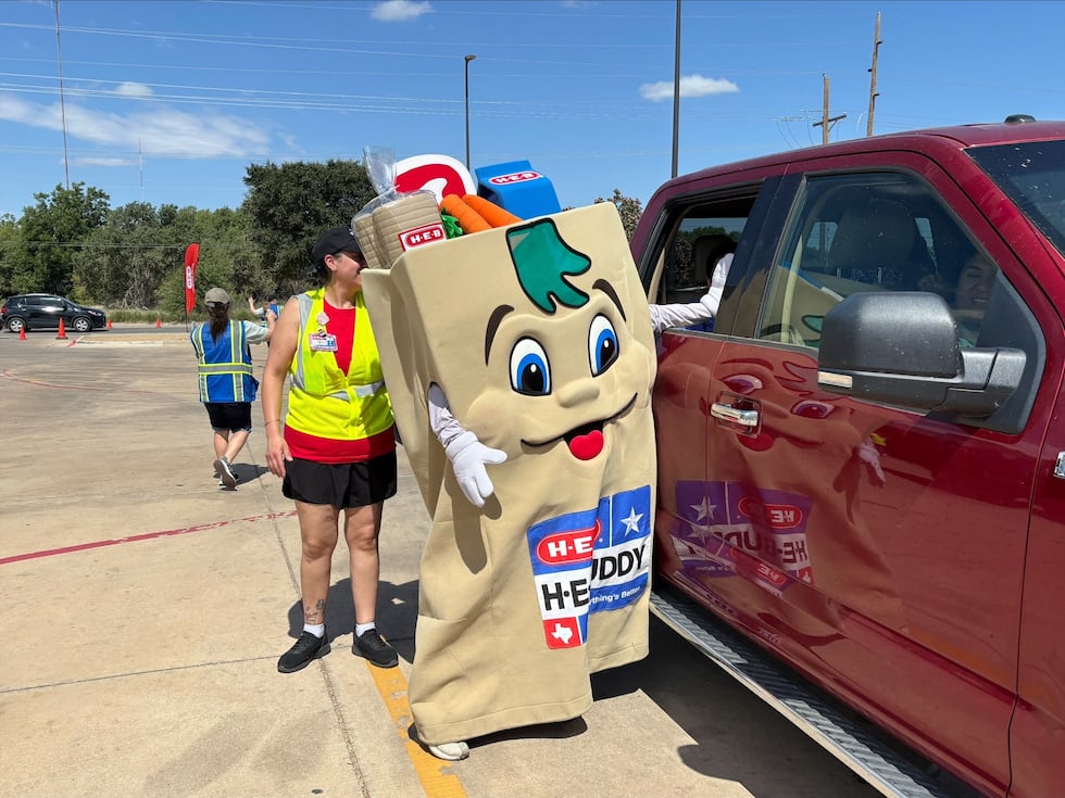 H-E-B brought its trucks to the South Plains Food Bank on Saturday to distribute bags of food...