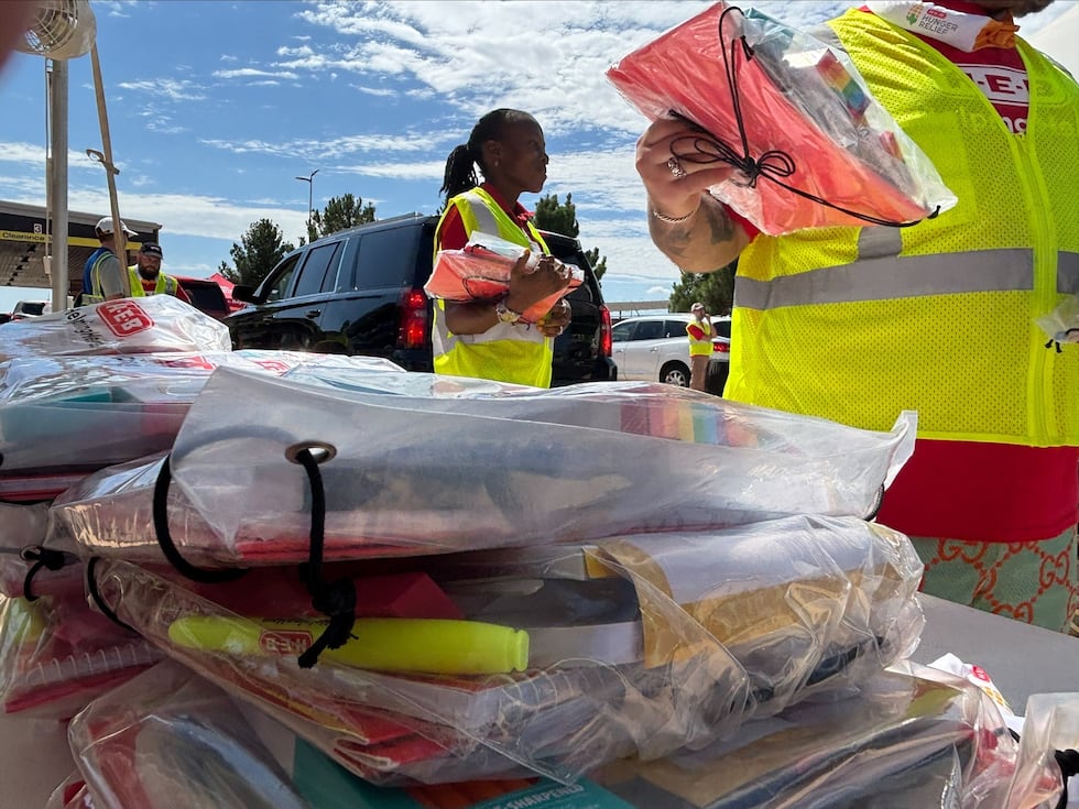 H-E-B brought its trucks to the South Plains Food Bank on Saturday to distribute bags of food...