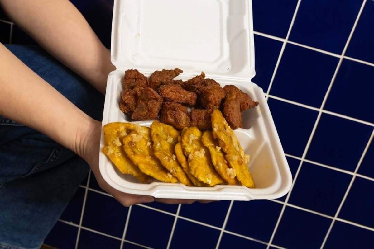 The carne frita and tostones are a Puerto Rican dish at Michy’s Chino Boricua. This is fried pork and fried garlic butter plantains.