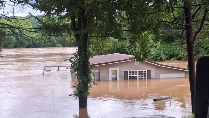 Another angle of a flooded home in Lesterville, Missouri.