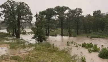 Floodwaters cover low-lying land near Comfort on July 15, 2026, after days of heavy rain raised waterways across the Texas Hill Country.