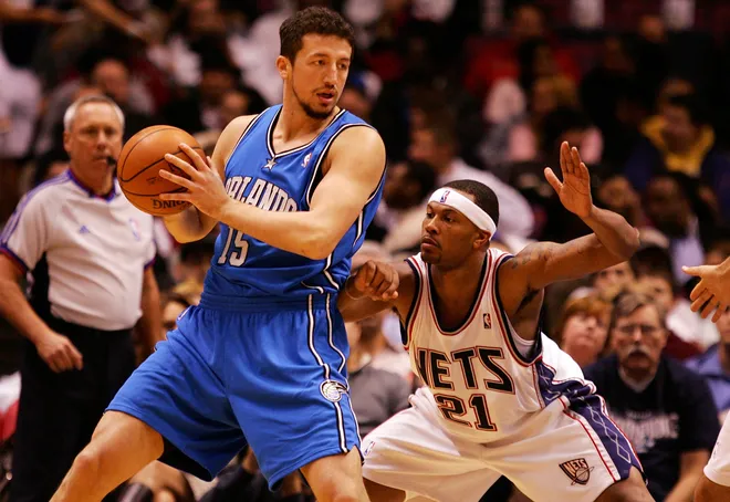 EAST RUTHERFORD, NJ - NOVEMBER 16: Antoine Wright #21 of the New Jersey Nets defends against Hedo Turkoglu #15 of the Orlando Magic during their game at the Izod Center on November 16, 2007 in East Rutherford, New Jersey.The Magic defeated the Nets 95-70. NOTE TO USER: User expressly acknowledges and agrees that, by downloading and/or using this Photograph, User is consenting to the terms and conditions of the Getty Images License Agreement. (Photo by Jim McIsaac/Getty Images)