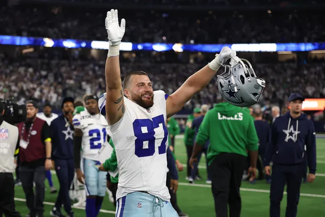 ARLINGTON, TEXAS - NOVEMBER 23: Jake Ferguson #87 of the Dallas Cowboys celebrates on the field after the game against the Philadelphia Eagles at AT&T Stadium on November 23, 2025 in Arlington, Texas. The Cowboys won 24-21. (Photo by Stacy Revere/Getty Images)