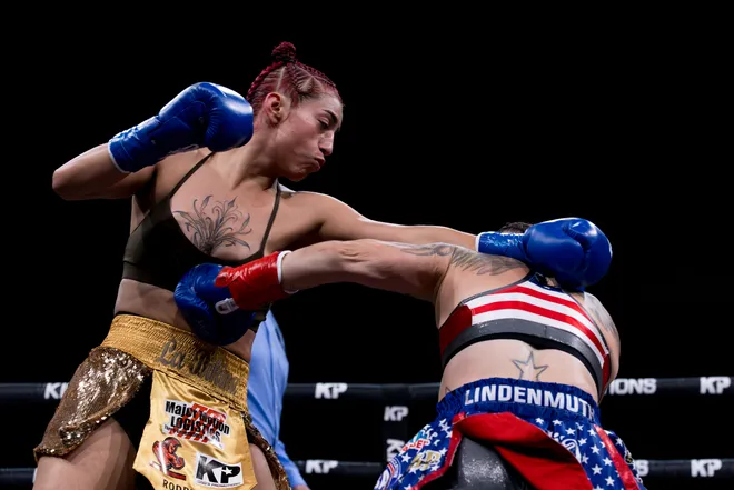 El Paso flyweight Nayeli Rodriguez, left, punches Katherine Lindenmuth during Kings Promotions' Ring Wars 23 boxing card at the El Paso County Coliseum on Saturday, July 18, 2026. Lindenmuth won the WIBA flyweight title by split decision.