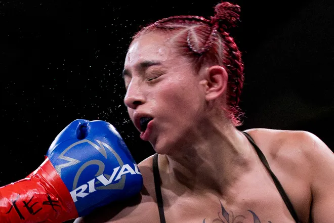 El Paso flyweight Nayeli Rodriguez takes a punch from Katherine Lindenmuth during Kings Promotions' Ring Wars 23 boxing card at the El Paso County Coliseum on Saturday, July 18, 2026.
