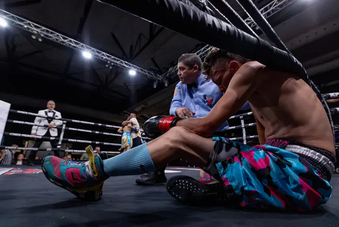 Austin Lewis sits after being knocked down by Las Cruces super flyweight D'Angelo Sanchez during Kings Promotions' Ring Wars 23 boxing card at the El Paso County Coliseum on Saturday, July 18, 2026. Sanchez later won by first-round stoppage.