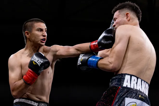New Mexico junior middleweight Elija Martinez, left, punches El Paso's Victor Aranda during Kings Promotions' Ring Wars 23 at the El Paso County Coliseum on Saturday, July 18, 2026.