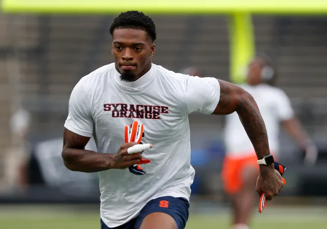 Syracuse Orange defensive back Alijah Clark (5) warms up ahead of the NCAA football game against the Purdue Boilermakers, Wednesday, July 12, 2023, at Ross-Ade Stadium in West Lafayette, Ind. Syracuse Orange won 35-20.