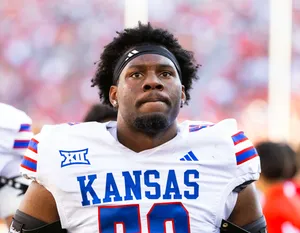 Nov 8, 2025; Tucson, Arizona, USA; Kansas Jayhawks defensive tackle D.J. Withers (52) against the Arizona Wildcats at Arizona Stadium. Mandatory Credit: Mark J. Rebilas-Imagn Images