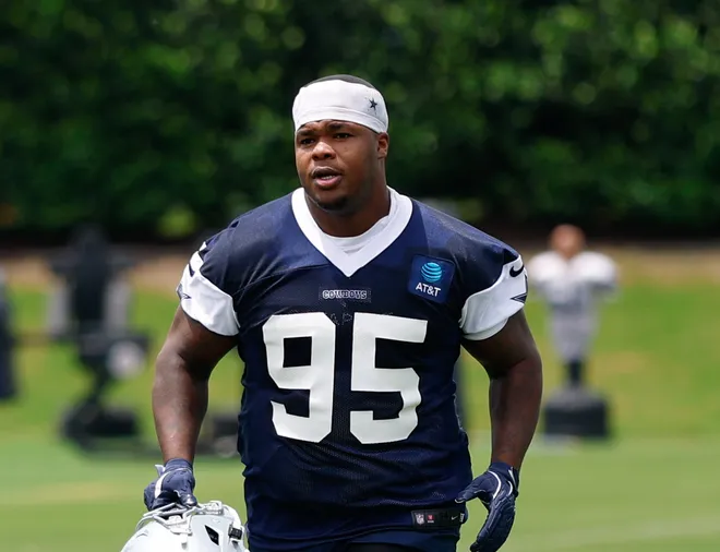 May 1, 2026; Frisco, TX, USA; Dallas Cowboys defensive end Adedayo Odeleye (96) and Dallas Cowboys defensive tackle Tommy Dunn (95) jog off the field after practice at the Ford Center at the Star Training Facility in Frisco, Texas. Mandatory Credit: Chris Jones-Imagn Images