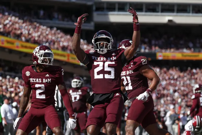 Nov 15, 2025; College Station, Texas, USA; Texas A & M Aggies safety Dalton Brooks (25) reacts after an interception during the second quarter against the South Carolina Gamecocks at Kyle Field. Mandatory Credit: Troy Taormina-Imagn Images