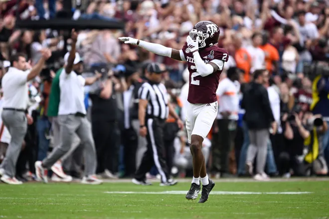 Dec 20, 2025; College Station, TX, USA; Texas A & M Aggies cornerback Dezz Ricks (2) celebrates after Miami Hurricanes miss a field goal during first half of the first round game of the CFP National Playoff at Kyle Field. Mandatory Credit: Jerome Miron-Imagn Images