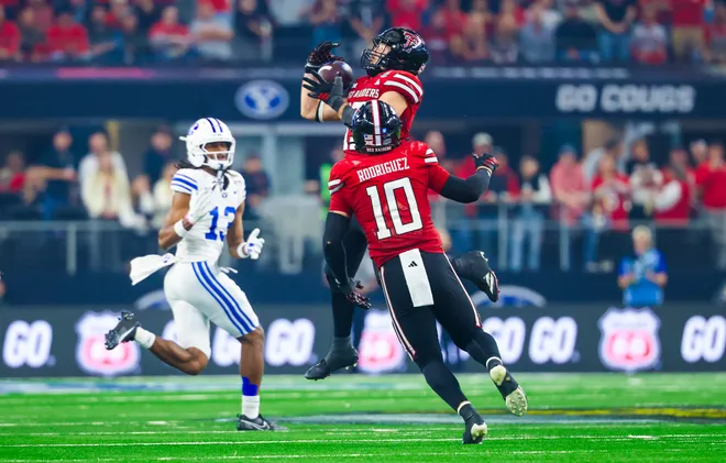 Dec 6, 2025; Arlington, TX, USA;  Texas Tech Red Raiders linebacker Ben Roberts (13) makes an interception intended for BYU Cougars wide receiver Jojo Phillips (13) during the second half at AT & T Stadium. Mandatory Credit: Kevin Jairaj-Imagn Images