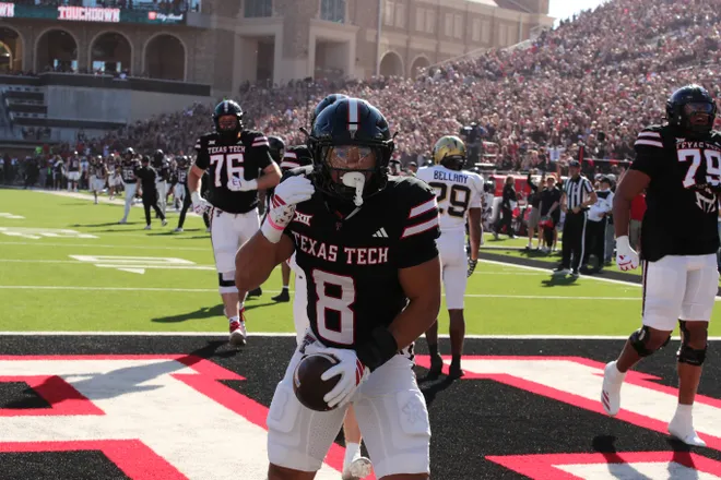 Nov 15, 2025; Lubbock, Texas, USA; Texas Tech Red Raiders running back Cameron Dickey (8) reacts after scoring a touchdown against the Central Florida Knights in the first half at Jones AT & T Stadium. Mandatory Credit: Michael C. Johnson-Imagn Images