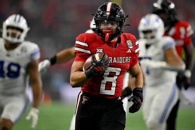 Dec 6, 2025; Arlington, TX, USA; Texas Tech Red Raiders running back Cameron Dickey (8) runs with the ball and scores a touchdown against the BYU Cougars during the second half at AT & T Stadium. Mandatory Credit: Jerome Miron-Imagn Images