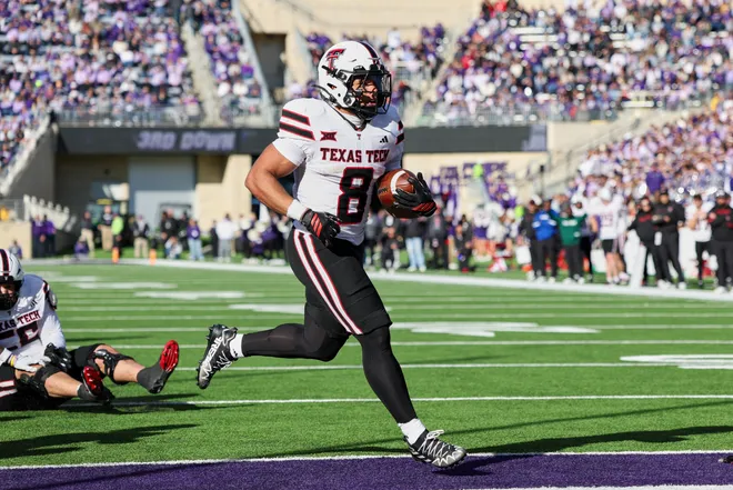 Nov 1, 2025; Manhattan, Kansas, USA; Texas Tech Red Raiders running back Cameron Dickey (8) scores a touchdown in the second quarter against the Kansas State Wildcats at Bill Snyder Family Football Stadium. Mandatory Credit: Scott Sewell-Imagn Images