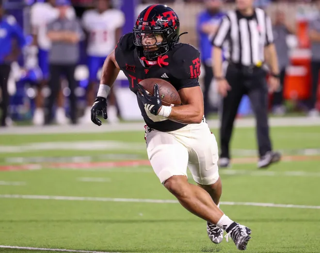 Texas Tech's Cameron Dickey runs with the ball against Kansas during a Big 12 Conference football game, Saturday, Oct. 11, 2025, at Jones AT & T Stadium in Lubbock.
