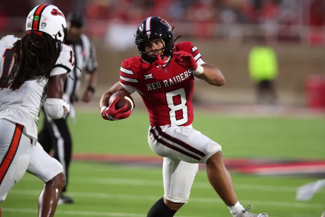 Sep 13, 2025; Lubbock, Texas, USA; Texas Tech Red Raiders running back Cameron Dickey (8) rushes against the Oregon State Beavers in the second half at Jones AT & T Stadium. Mandatory Credit: Michael C. Johnson-Imagn Images