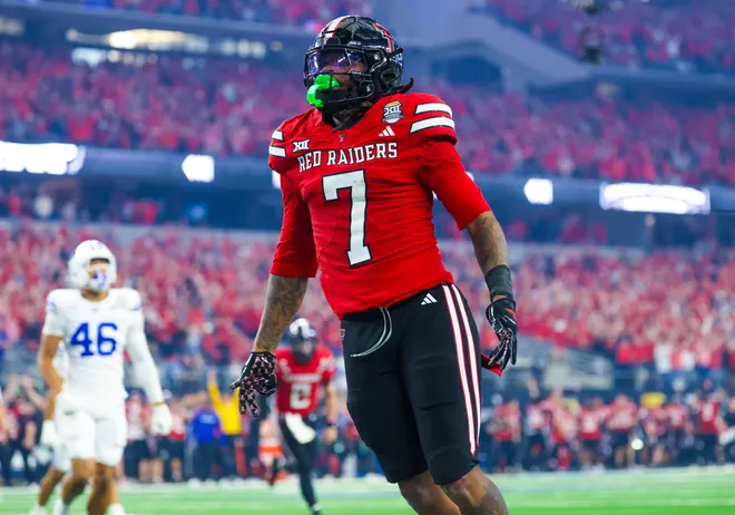 Dec 6, 2025; Arlington, TX, USA; Texas Tech Red Raiders tight end Terrance Carter Jr. (7) reacts after scoring a two point conversion during the second half against the BYU Cougars at AT & T Stadium. Mandatory Credit: Kevin Jairaj-Imagn Images
