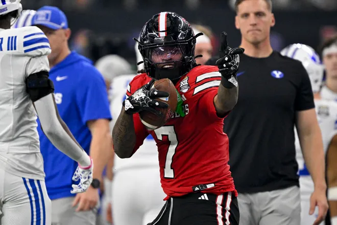 Dec 6, 2025; Arlington, TX, USA; Texas Tech Red Raiders tight end Terrance Carter Jr. (7) celebrates after making a first down against the BYU Cougars during the first half at AT & T Stadium. Mandatory Credit: Jerome Miron-Imagn Images