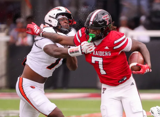 Texas Tech's Terrance Carter Jr. is met by Oregon State's Dexter Foster during a non-conference football game, Saturday, Sept. 13, 2025, at Jones AT & T Stadium.