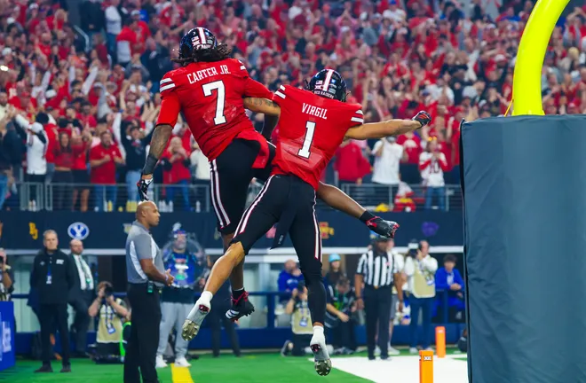 Dec 6, 2025; Arlington, TX, USA; Texas Tech Red Raiders tight end Terrance Carter Jr. (7) celebrates with Texas Tech Red Raiders wide receiver Reggie Virgil (1) after scoring a two point conversion during the second half against the BYU Cougars at AT & T Stadium. Mandatory Credit: Kevin Jairaj-Imagn Images