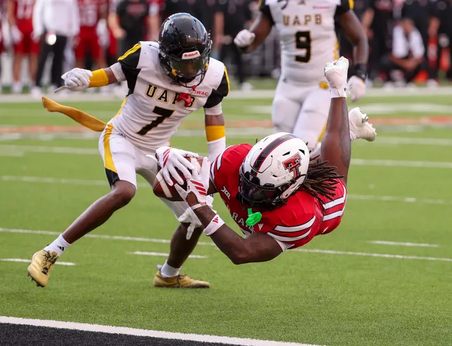 Texas Tech's Terrance Carter Jr. dives in for a touchdown against Arkansas-Pine Bluff during a non-conference football game, Saturday, August 30, 2025, at Jones AT & T Stadium.
