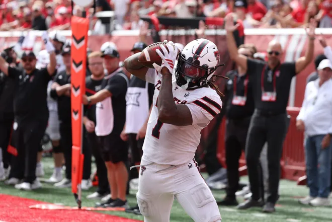 Sep 20, 2025; Salt Lake City, Utah, USA; Texas Tech Red Raiders tight end Terrance Carter Jr. (7) makes a catch for a touchdown against the Utah Utes during the fourth quarter at Rice-Eccles Stadium. Mandatory Credit: Rob Gray-Imagn Images