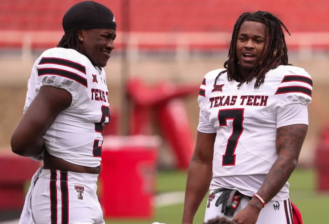 Tight ends Terrance Carter Jr. (right) and Johncarlos Miller II await the start of the Texas Tech football team's spring game, Saturday, April 19, 2025, at Jones AT & T Stadium.