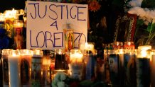 Candles are lit during a vigil for Lorenzo Salgado Araujo, a Mexican national fatally shot by a federal immigration agent a day prior, Wednesday, July 8, 2026, in Houston. (AP Photo/Mark Felix)
