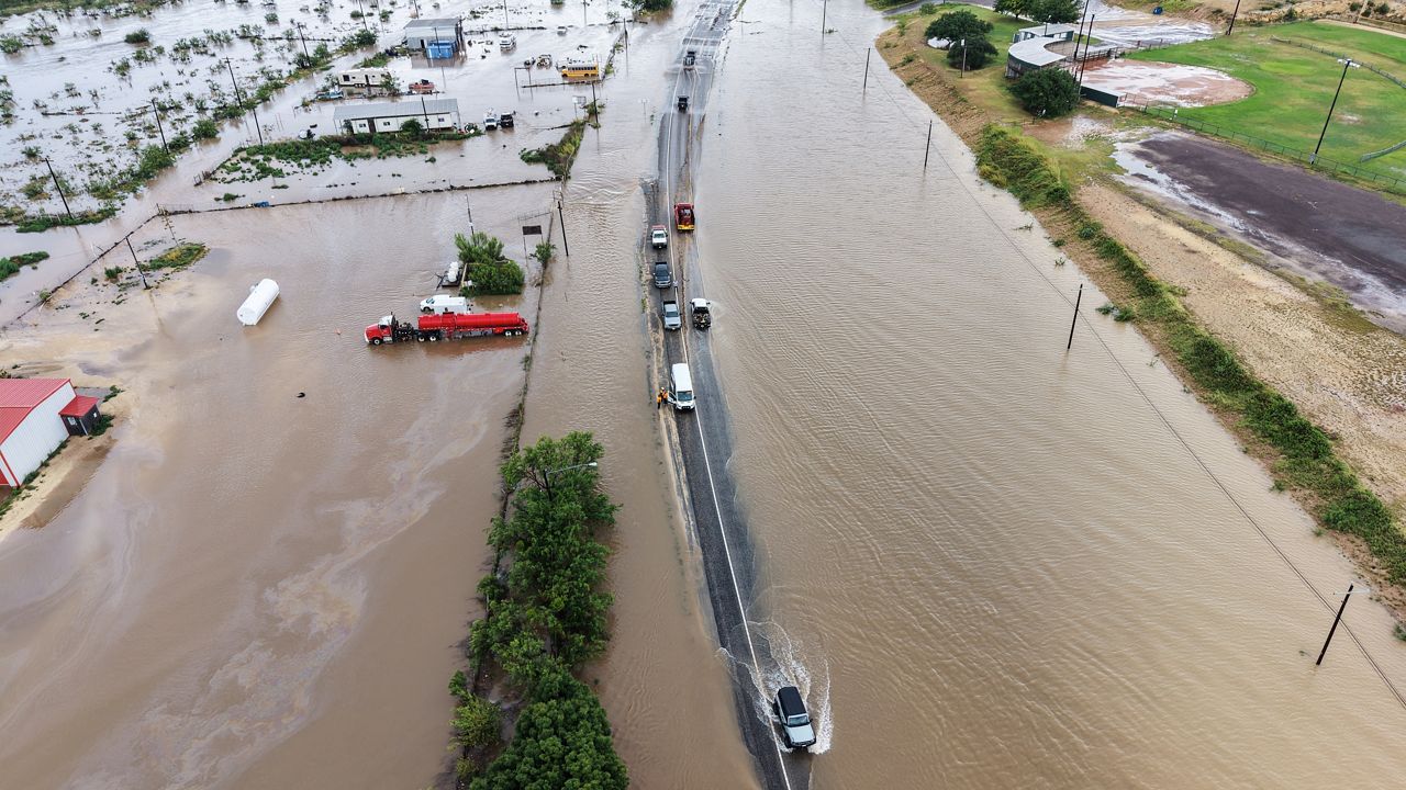 An aerial view shows flooding on Friday, July 17, 2026, in Ozona, Texas. (AP Photo/Gerald Herbert)