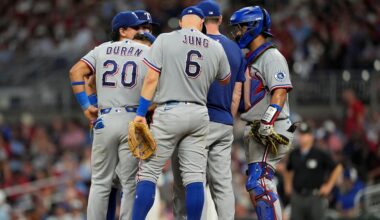 The Texas Rangers speak with pitcher Emiliano Teodo on the mound in the fifth inning of a baseball game against the Atlanta Braves, Friday, July 17, 2026, in Atlanta. (AP Photo/Mike Stewart)
