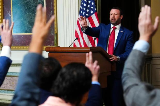 Homeland Security Secretary Markwayne Mullin speaks to reporters in the Indian Treaty Room at the Eisenhower Executive Office Building on the White House campus, Friday, July 17, 2026, in Washington. (AP Photo/Julia Demaree Nikhinson)