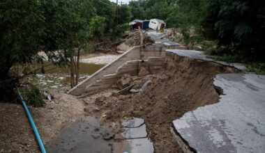 A partially-collapsed bridge crossing Goat Creek is damaged following floods near the Guadalupe River on Friday, July 17, 2026, in Kerrville, Texas. (AP Photo/Joel Angel Juarez)