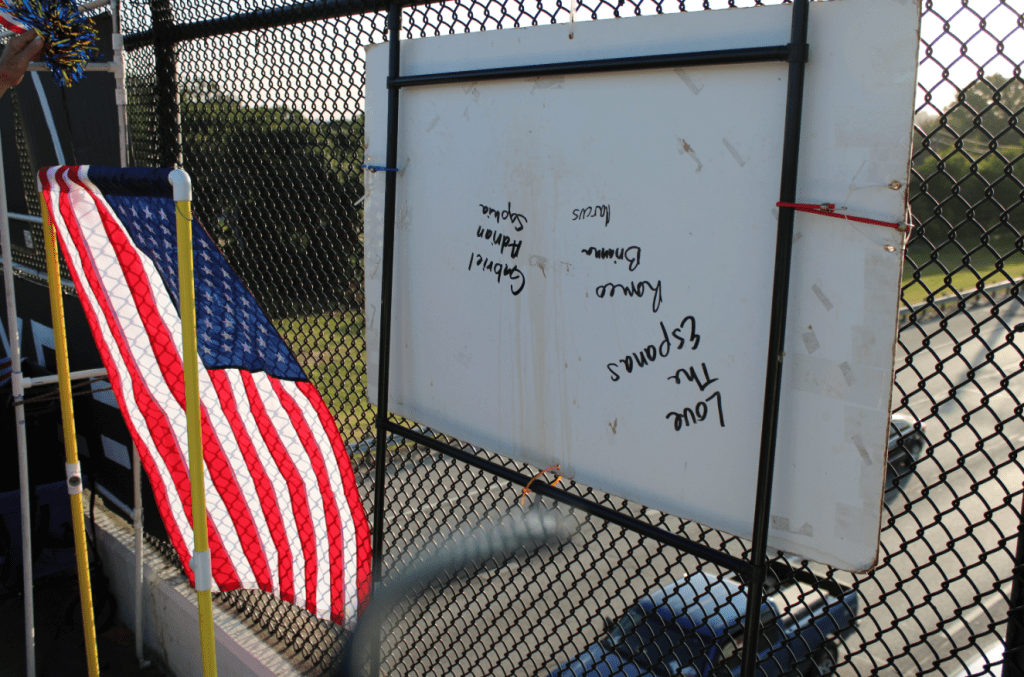 The backside of signs and flags, which are attached to PVC piping to comply with state regulations.