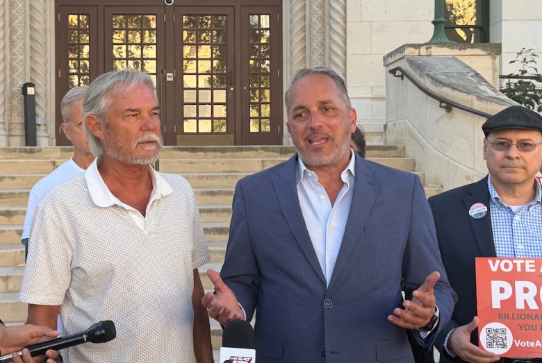 Former Councilman Greg Brockhouse speaks to reporters in front of City Hall.