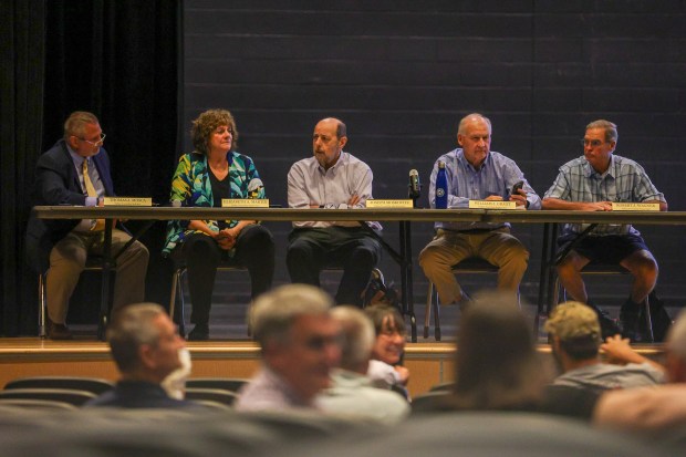 Board members confer prior to a Dallas Twp. data center ordinance hearing at Dallas High School on Tuesday, July 28, 2026. (JASON ARDAN / STAFF PHOTOGRAPHER)