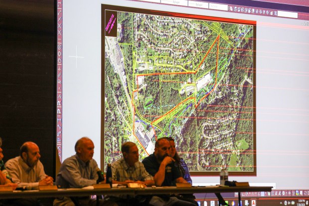 Board members present a graphic during a Dallas Twp. data center ordinance hearing at Dallas High School on Tuesday, July 28, 2026. (JASON ARDAN / STAFF PHOTOGRAPHER)