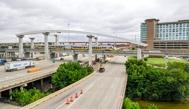 DART Silver Line Bridge Arches with train passing over highway