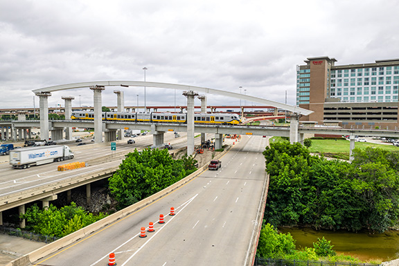 DART Silver Line Bridge Arches with train passing over highway