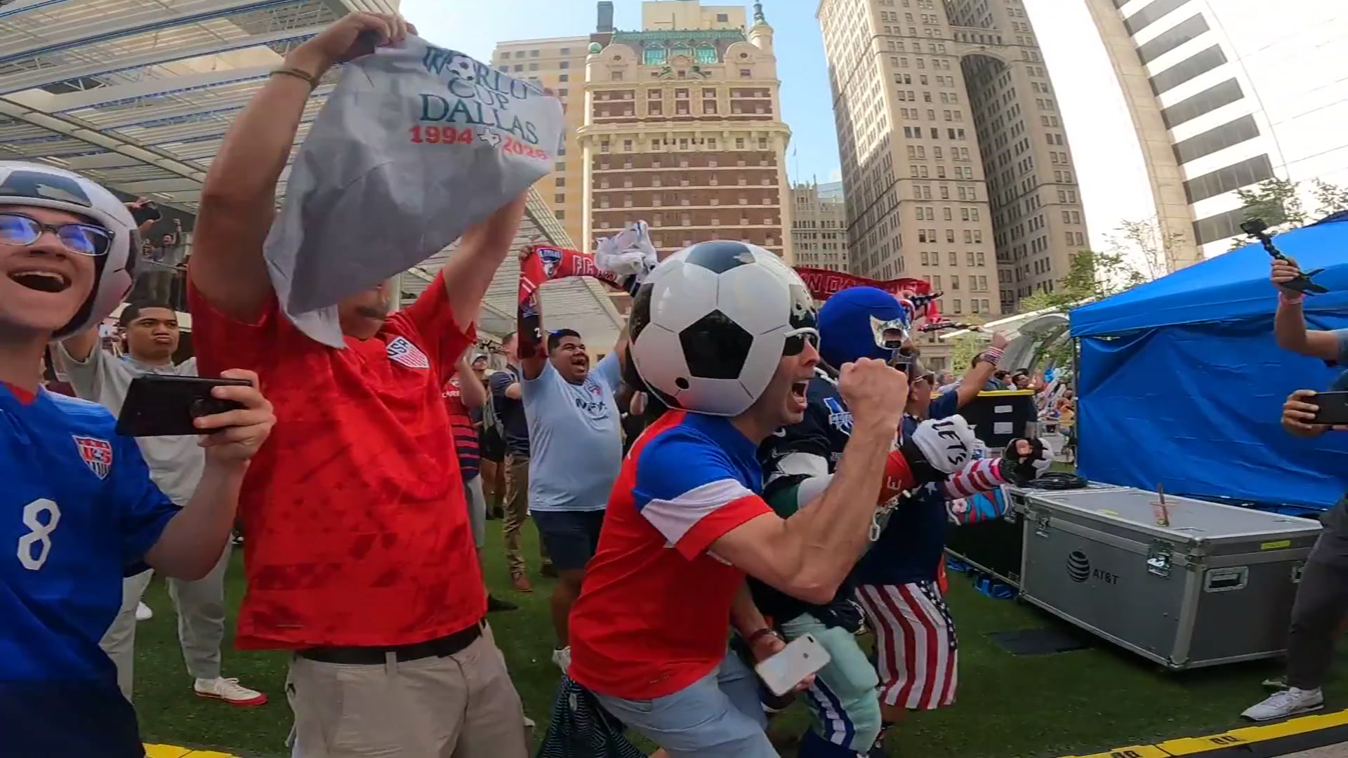Croatia fans march in Downtown Dallas with a supporter flag. Fans celebrated with parties, parades, and plenty of team spirit. Croatia lost the game against England 4-2.