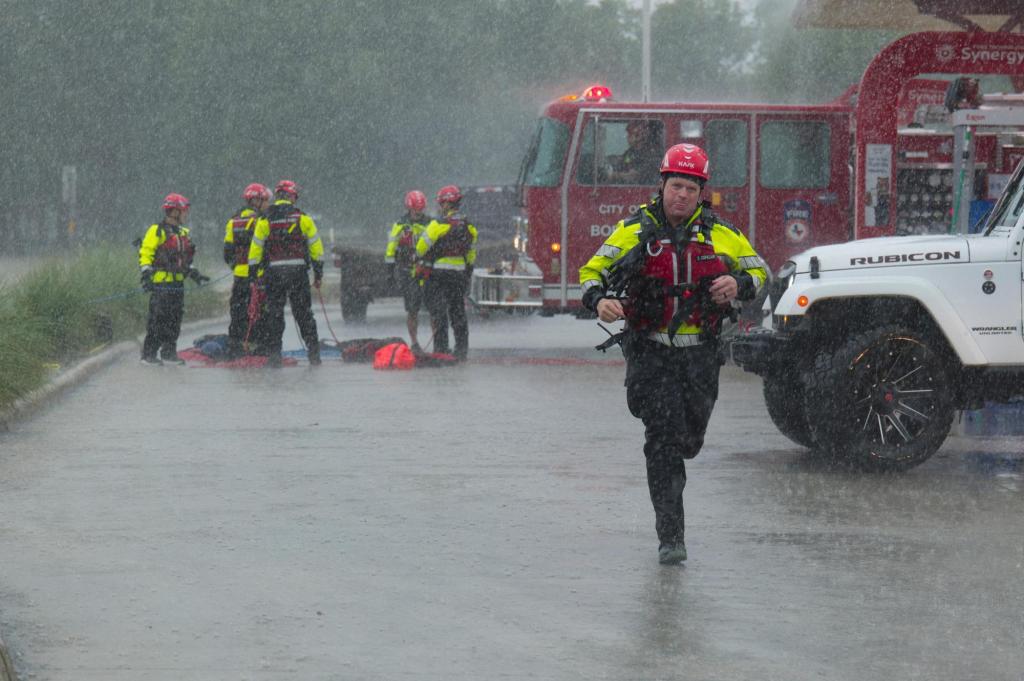 Texas flooding surges as rescuers pull people from rising waters