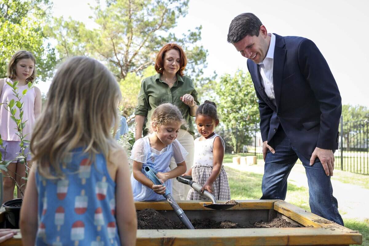 James Talarico helps preschoolers Catalina Cortes and Amelia Abeyta, both 4 years old, garden at Green Space Nature Preschool on Tuesday, July 21, 2026 in Fort Worth. Talarico was a sponsor of Proposition 2, which allows local governments to provide property tax relief to eligible childcare providers, that was approved in a voter referendum in 2023.