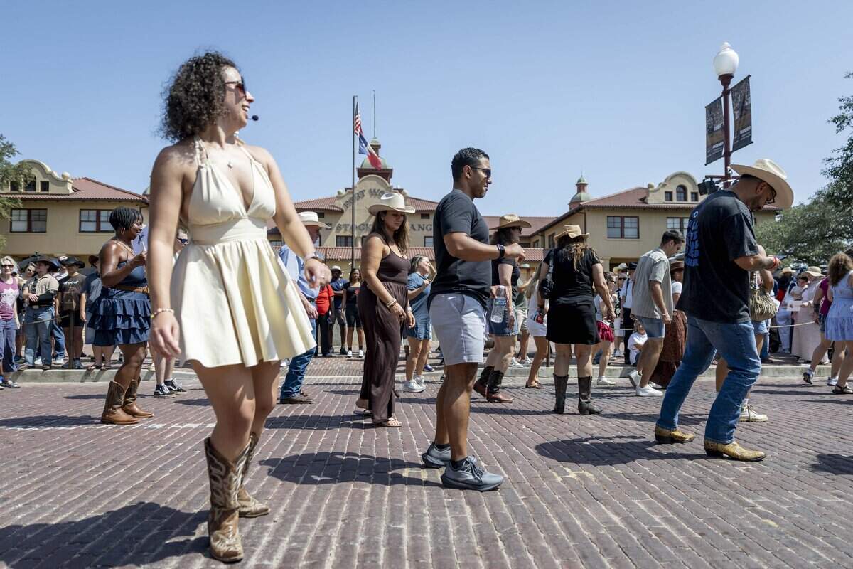 People learn to line dance on National Day of the American Cowboy on Saturday, July 25, 2026 at the Fort Worth Stockyards. This year marked the 20th anniversary of the national day.