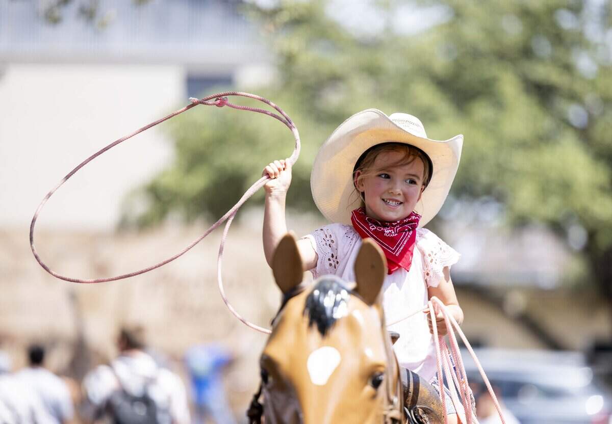 Rosalie Boyle, 4, learns how to rope during National Day of the American Cowboy on Saturday, July 25, 2026 in Fort Worth. The Stockyards hosted the celebration with activities for the whole family.