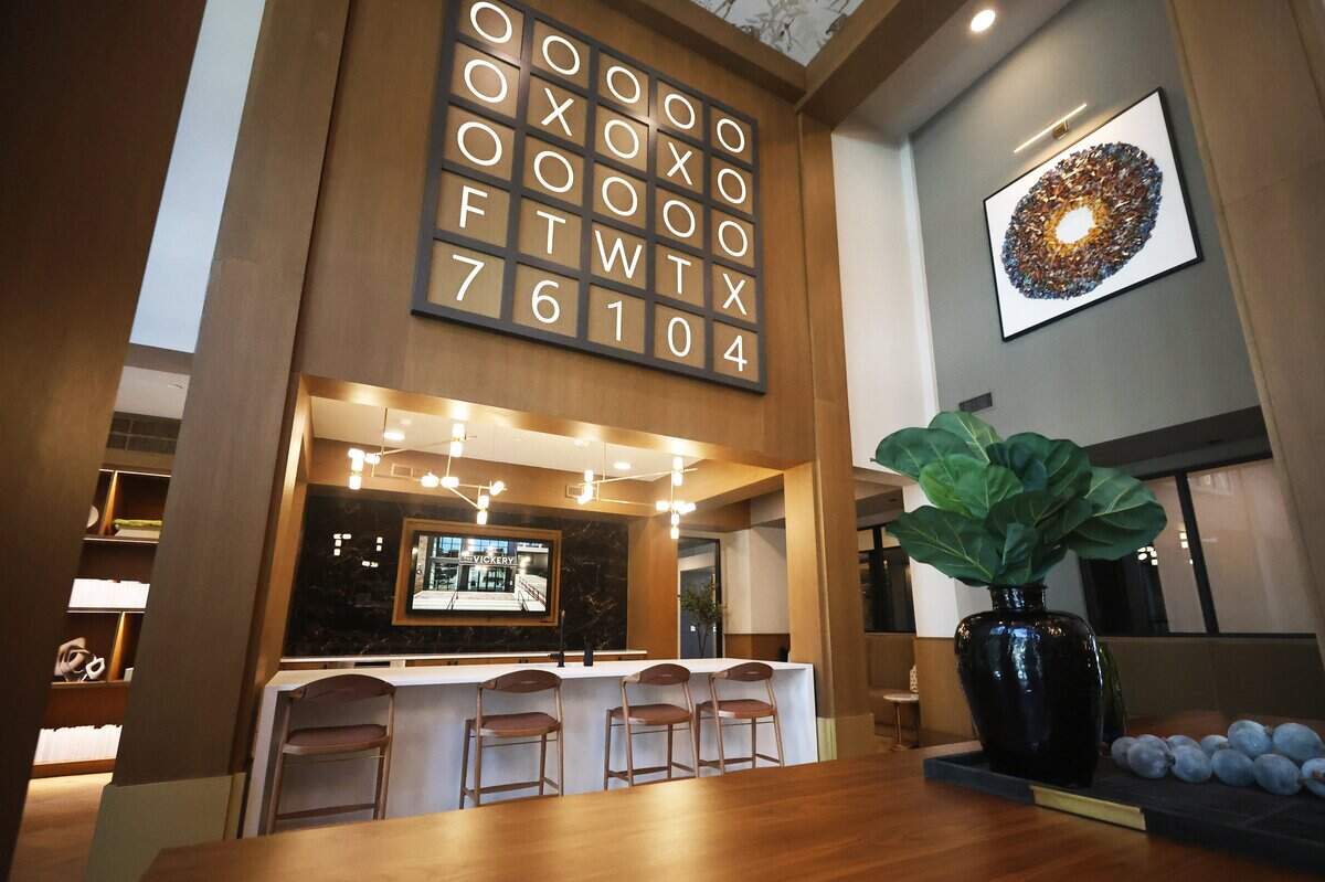 A sign displaying the area code and city of The Vickery apartments hangs in the game room on Vickery Boulevard in Fort Worth on July 10, 2026.